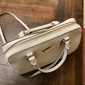 White Michael Kors saffiano leather handbag with gold and zipper hardware.